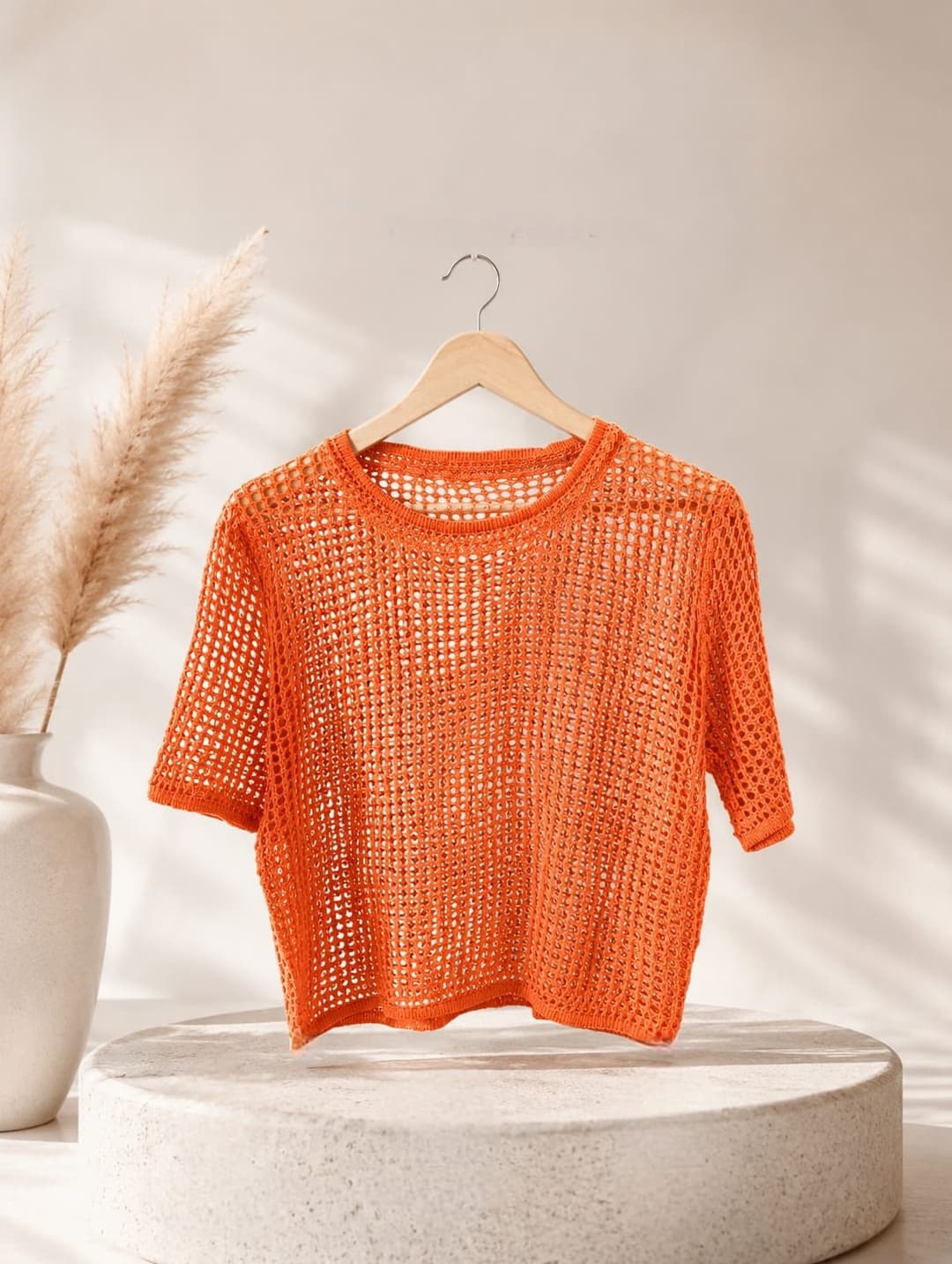 vibrant orange open-stitch mesh crochet crop top